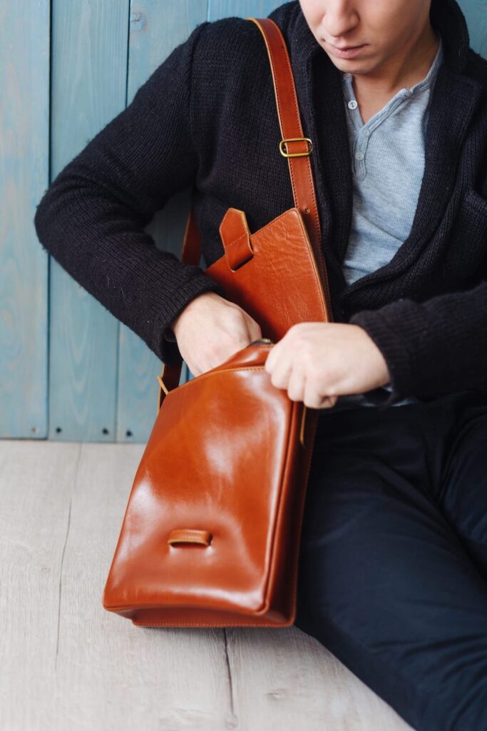 handsome guy with leather bag YXUVNZK